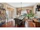 Traditional dining area with hardwood floors, natural light, and seating for six at 545 Creek Landing Ln, Alpharetta, GA 30005