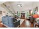 Comfortable living room features hardwood floors, fireplace, and a staircase leading to the upper level at 545 Creek Landing Ln, Alpharetta, GA 30005
