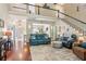 Spacious living room with hardwood floors, soaring ceilings, and views to the dining room at 545 Creek Landing Ln, Alpharetta, GA 30005