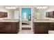 En-suite bathroom with dual vanities and a doorway to the Primary bedroom at 545 Creek Landing Ln, Alpharetta, GA 30005