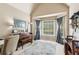 Bright office space with a large window, vaulted ceilings, and natural light at 545 Creek Landing Ln, Alpharetta, GA 30005