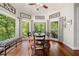 Dining room with a wooden table, high ceilings, and natural light from oversized windows at 560 Indigo Dr, Roswell, GA 30075