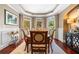 Elegant dining room with a bay window, hardwood floors, and neutral paint colors at 560 Indigo Dr, Roswell, GA 30075