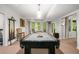 Basement game room featuring a pool table, a window view, and carpet floors offers a fun entertaining space at 560 Indigo Dr, Roswell, GA 30075