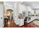 Charming kitchen area with white cabinets, a wooden desk, and modern appliances at 560 Indigo Dr, Roswell, GA 30075