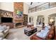 Inviting living room with a fireplace, high ceilings, and lots of natural light at 560 Indigo Dr, Roswell, GA 30075
