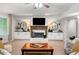 Living room featuring a fireplace, built-in cabinets and a chess set offers a relaxing space at 560 Indigo Dr, Roswell, GA 30075