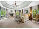 Spacious main bedroom features a fireplace, sitting area, tray ceiling, and access to a private balcony at 560 Indigo Dr, Roswell, GA 30075