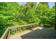 Private deck overlooking lush green foliage offers serene outdoor space at 6182 Silver Spur Dr, Lithonia, GA 30058