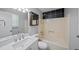 This bathroom features black tile accents and a shower over tub at 6182 Silver Spur Dr, Lithonia, GA 30058