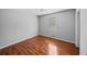 This bedroom features pristine neutral walls and beautiful hardwood floors at 6182 Silver Spur Dr, Lithonia, GA 30058