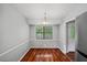 Cozy dining area adjacent to the kitchen, featuring a stylish light fixture at 6182 Silver Spur Dr, Lithonia, GA 30058