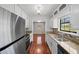 Modern kitchen with stainless steel appliances, granite countertops, and ample cabinet space at 6182 Silver Spur Dr, Lithonia, GA 30058