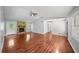 Bright living room with hardwood floors, vaulted ceiling, and a cozy stone fireplace at 6182 Silver Spur Dr, Lithonia, GA 30058