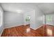 Open-concept living space with hardwood floors, light-filled dining area, and seamless flow at 6182 Silver Spur Dr, Lithonia, GA 30058