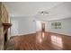 Comfortable living room with hardwood floors, fireplace, and large windows overlooking the yard at 6182 Silver Spur Dr, Lithonia, GA 30058