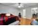 Comfortable bedroom featuring hardwood floors and a ceiling fan at 8106 Santa Fe Pkwy, Atlanta, GA 30350