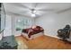 Bright bedroom illuminated by natural light with hardwood flooring at 8106 Santa Fe Pkwy, Atlanta, GA 30350