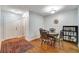 Cozy dining room with hard wood floors, decorative rug and storage at 8106 Santa Fe Pkwy, Atlanta, GA 30350