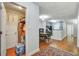 Hallway shows entry to kitchen and pantry, with natural light from entry doorway at 8106 Santa Fe Pkwy, Atlanta, GA 30350
