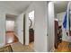 Hallway features tile floor, laundry room, linen closet, and bath access at 8106 Santa Fe Pkwy, Atlanta, GA 30350