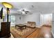 Bright living room features hardwood floors and sliding glass doors to the outside patio at 8106 Santa Fe Pkwy, Atlanta, GA 30350