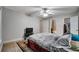 Comfortable main bedroom boasts closet, en suite bathroom, and neutral color palette at 8106 Santa Fe Pkwy, Atlanta, GA 30350