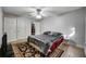 Bright main bedroom features walk-in closet, neutral paint, and decorative carpet at 8106 Santa Fe Pkwy, Atlanta, GA 30350