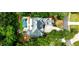 Stunning aerial view of a home with a backyard oasis, pool, fire pit, and lush landscaping at 1114 Waterford Green Pt, Marietta, GA 30068