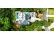 Aerial view of home showcasing the large in-ground pool and verdant landscaping at 1114 Waterford Green Pt, Marietta, GA 30068