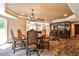 Finished basement area featuring a pool table, wet bar, dining table and decorative chandelier at 1114 Waterford Green Pt, Marietta, GA 30068