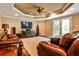 Comfortable basement living room with leather couches, large tv and speaker system, and glass patio doors at 1114 Waterford Green Pt, Marietta, GA 30068