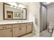 Bright bathroom with white vanity, framed mirror, and shower with patterned curtain at 1114 Waterford Green Pt, Marietta, GA 30068