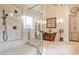 This bathroom features a frameless glass shower and copper soaking tub at 1114 Waterford Green Pt, Marietta, GA 30068