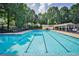Large community pool with swimming lanes, seating and shade umbrellas at 1114 Waterford Green Pt, Marietta, GA 30068
