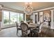 Elegant dining room featuring a round table, chandelier, and large windows at 1114 Waterford Green Pt, Marietta, GA 30068