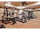 Spacious exercise room with full gym and treadmill equipment, mirrored wall, and neutral carpeting at 1114 Waterford Green Pt, Marietta, GA 30068
