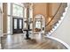 Grand foyer features soaring ceilings, hardwood floors, and statement staircase at 1114 Waterford Green Pt, Marietta, GA 30068