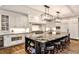Stunning kitchen featuring an island with seating, white cabinetry, and stainless steel appliances at 1114 Waterford Green Pt, Marietta, GA 30068
