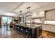 Spacious kitchen boasts an island with seating, stainless appliances, and an adjacent fireplace at 1114 Waterford Green Pt, Marietta, GA 30068