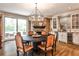 Eat-in kitchen features stone fireplace, bar area, and stainless steel appliances at 1114 Waterford Green Pt, Marietta, GA 30068