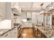 Eat-in kitchen with granite countertops, stainless steel appliances, and a large center island at 1114 Waterford Green Pt, Marietta, GA 30068