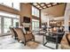 Bright living room with fireplace, large windows, high ceilings, and views of the yard at 1114 Waterford Green Pt, Marietta, GA 30068