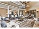 Open-concept living room features high ceilings, comfortable seating, and a view to the dining area at 1114 Waterford Green Pt, Marietta, GA 30068