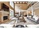 Spacious living room with soaring ceilings, stone fireplace, and natural light from the french doors at 1114 Waterford Green Pt, Marietta, GA 30068