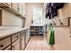 Well-organized mud room with custom cabinets, shoe storage, coat hooks, and granite counters at 1114 Waterford Green Pt, Marietta, GA 30068