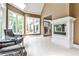 Bright and airy sitting room with large windows, comfortable seating, and a fireplace at 1114 Waterford Green Pt, Marietta, GA 30068