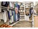 Organized walk-in closet featuring ample hanging space, shelving, and drawers for clothing and accessories at 1114 Waterford Green Pt, Marietta, GA 30068