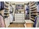 Spacious walk-in closet with custom shelving, drawers, and ample storage for clothes and shoes at 1114 Waterford Green Pt, Marietta, GA 30068