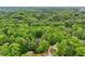 This property is surrounded by lush tree coverage, creating a serene environment at 1275 Smokehouse Trl, Cumming, GA 30041